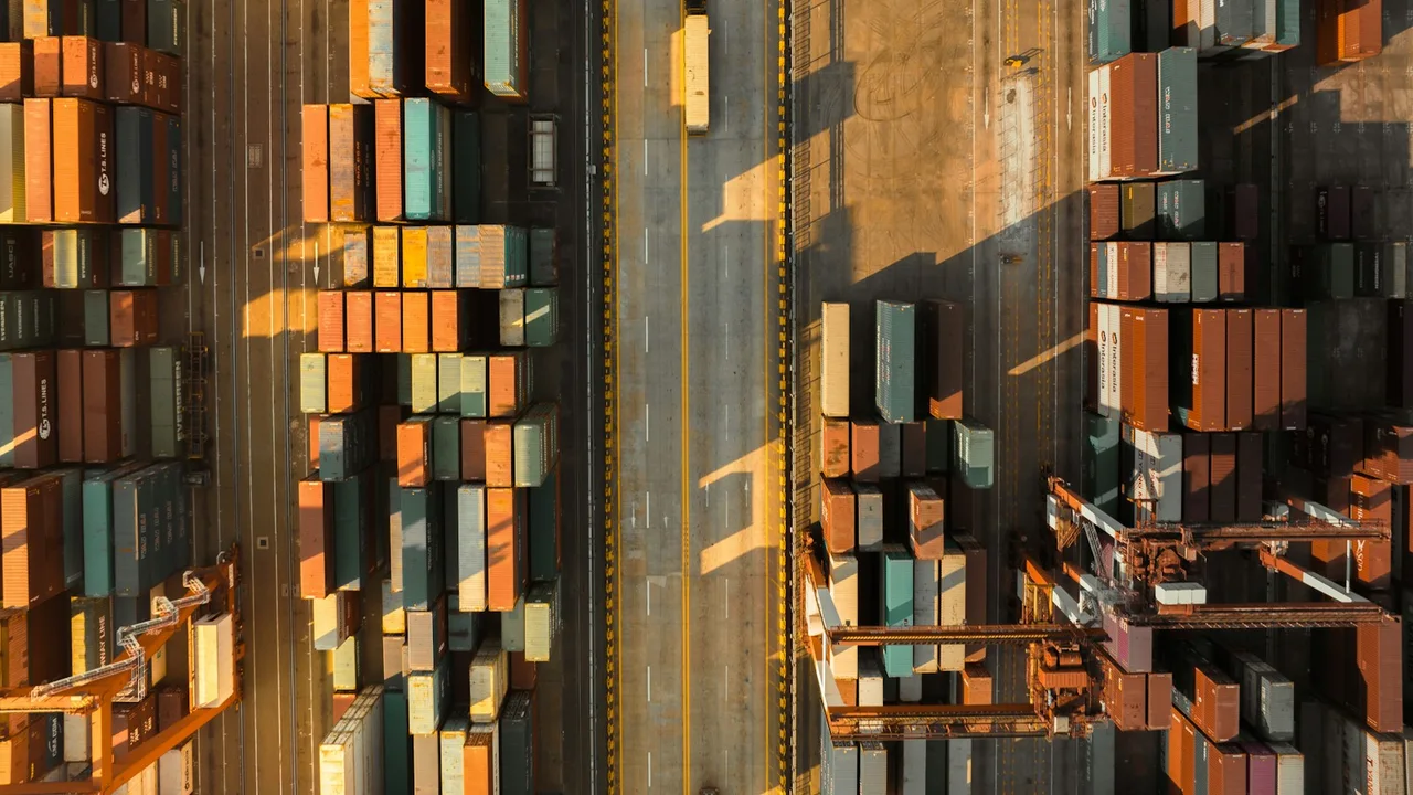 an aerial view of shipping containers at a port