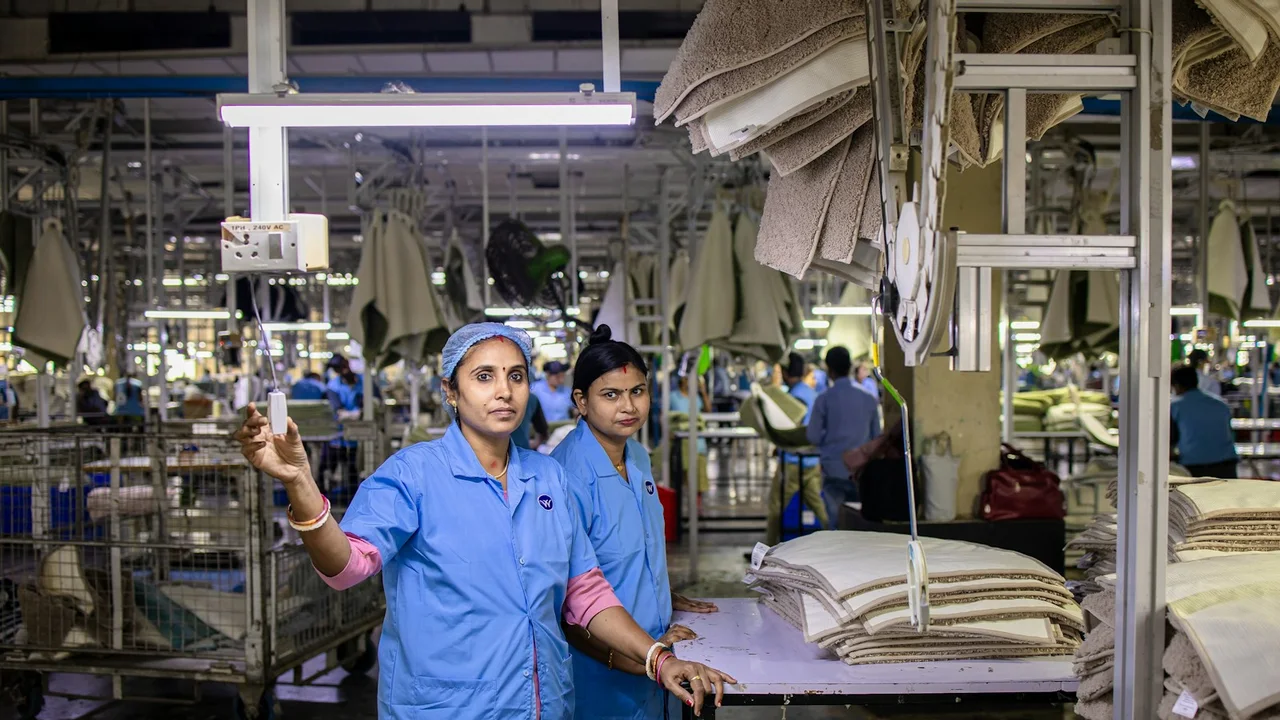 Factory workers oversee production in a modern factory